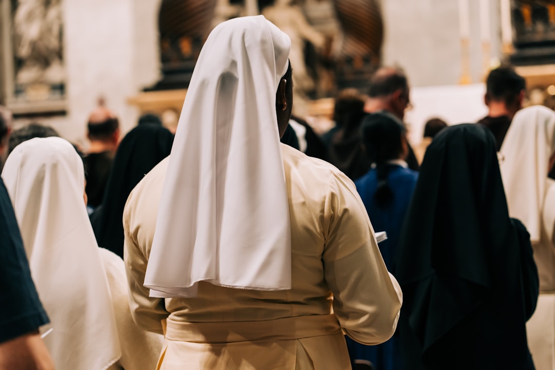 a group of people dressed in white and black a group of people dressed in white and black